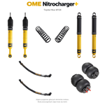 Zawieszenie OME Nitrocharger+ Toyota Hilux Travo MY26 20/50 mm – stałe 300 kg z tyłu, bez osprzętu lub lekki zderzak, paraboliczne + poduszki / mocniejsze tłumienie przodu – bez dystansu przewodów hamulcowych