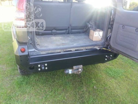 Zderzak tył do wersji z plastikowymi poszerzeniami nadkoli Toyota Land Cruiser J125