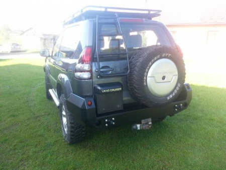 Zderzak tył do wersji z plastikowymi poszerzeniami nadkoli Toyota Land Cruiser J125